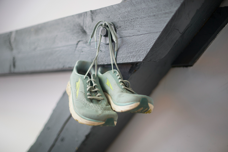 A pair of sneakers hanging in the office